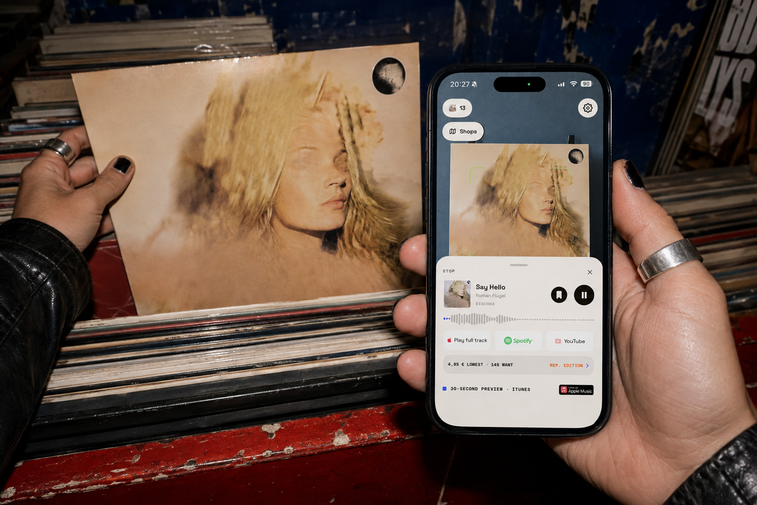 First-person view of a record digger using DISCTALE to recognise Mutter by Roman Flügel and listen to Say Hello on an iPhone